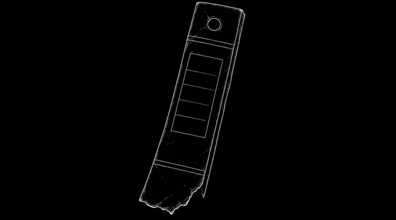 A broken binder spine fragment on a black background, representing fragmented knowledge structures and residual organization.